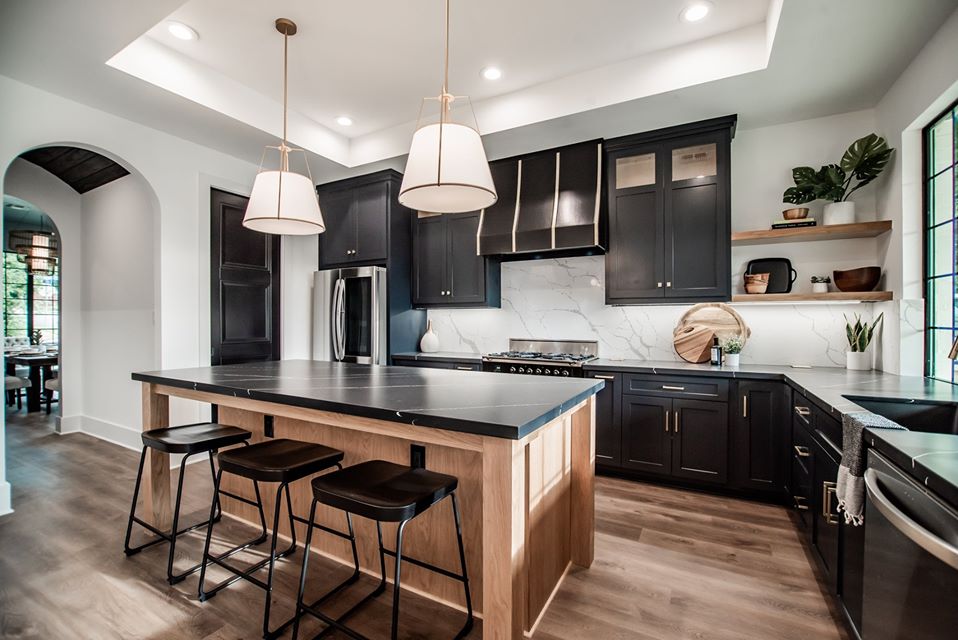 Bright finished ALES kitchen remodel with black cabinetry and a wood island