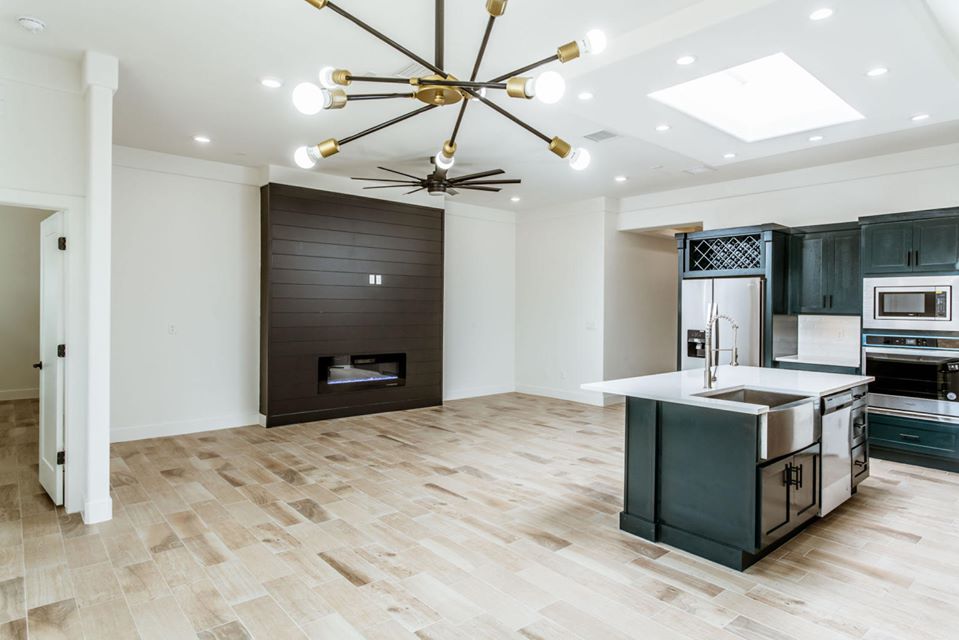 Connected kitchen and living room with custom lighting